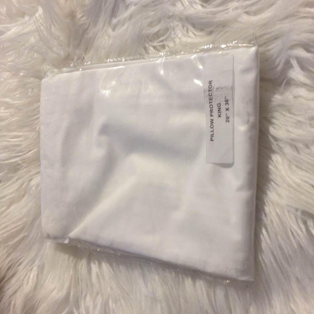 1 white zippered king pillow protector 20"x 36"